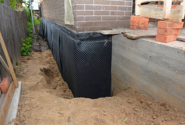Happy homeowners after waterproofing job in Yeoman